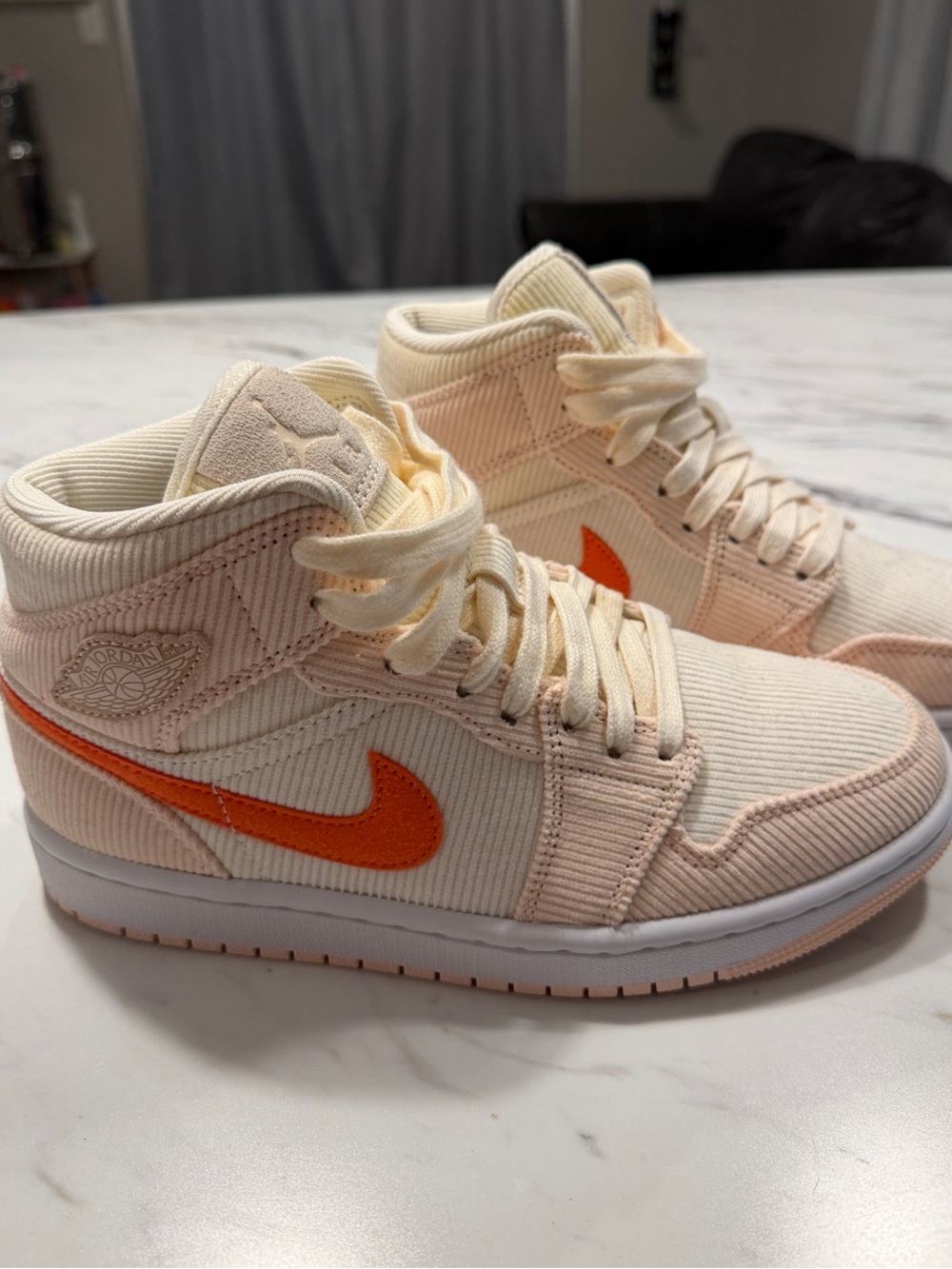 Nike Women’s Mid-Top Sneakers in Cream with Orange Swoosh